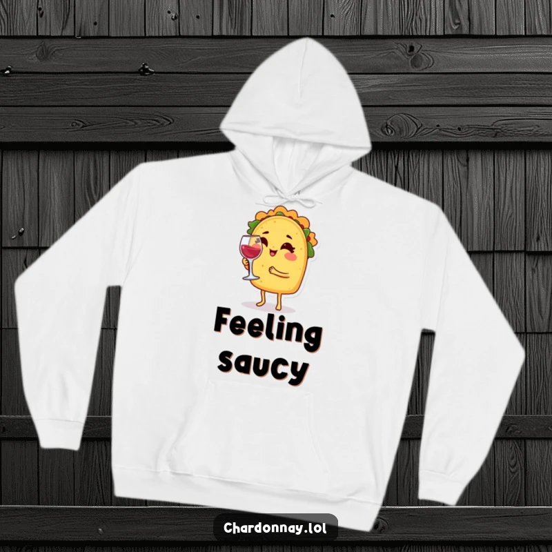 Funny hoodie featuring a taco character winking and balancing a tiny wine glass, offering warmth and a flavorful sense of humor.